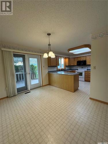 532 Simpson Crescent, Hudson Bay, SK - Indoor Photo Showing Kitchen With Double Sink