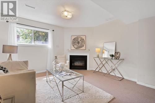 33 - 2940 Headon Forest Drive, Burlington, ON - Indoor Photo Showing Living Room With Fireplace