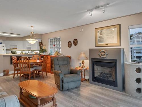 202-350 Island Hwy South, Campbell River, BC - Indoor Photo Showing Living Room With Fireplace