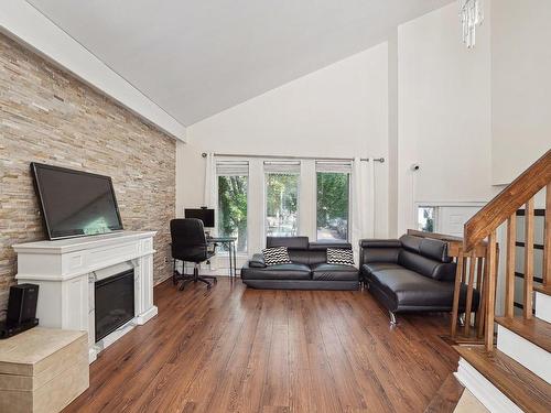 Living room - 101 Rue Sarah-Garth, Blainville, QC - Indoor Photo Showing Living Room With Fireplace