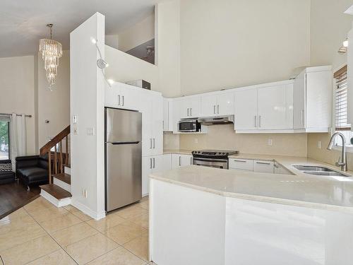 Cuisine - 101 Rue Sarah-Garth, Blainville, QC - Indoor Photo Showing Kitchen With Double Sink