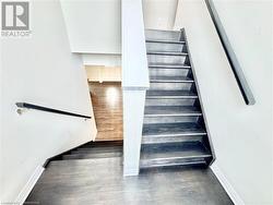 Stairway with hardwood / wood-style floors - 