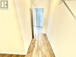 Hall featuring light hardwood / wood-style flooring - 