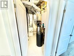 Utility room featuring heating unit - 