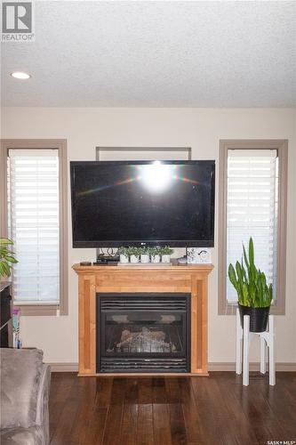 101 2501 Windsor Park Road, Regina, SK - Indoor Photo Showing Living Room With Fireplace