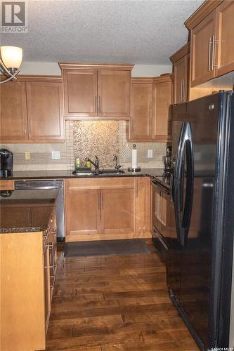 101 2501 Windsor Park Road, Regina, SK - Indoor Photo Showing Kitchen With Double Sink