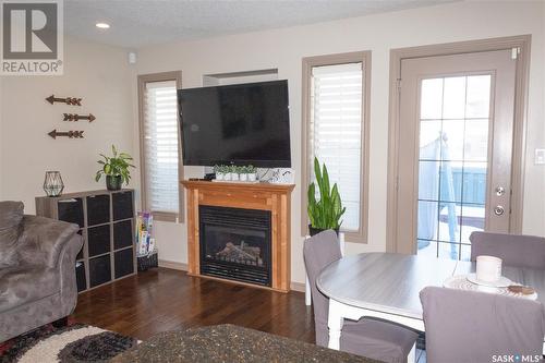 101 2501 Windsor Park Road, Regina, SK - Indoor Photo Showing Living Room With Fireplace