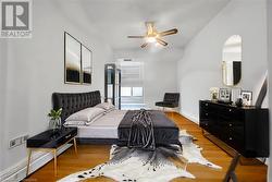 Bedroom with hardwood / wood-style floors and ceiling fan Virtual Stage - 