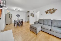 Living room with wood-type flooring - 