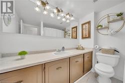 Bathroom featuring vanity and toilet - 