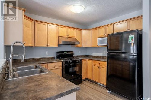 7167 Wascana Cove Drive, Regina, SK - Indoor Photo Showing Kitchen With Double Sink