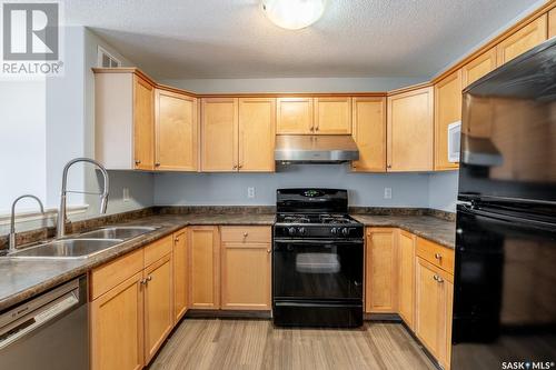 7167 Wascana Cove Drive, Regina, SK - Indoor Photo Showing Kitchen With Double Sink