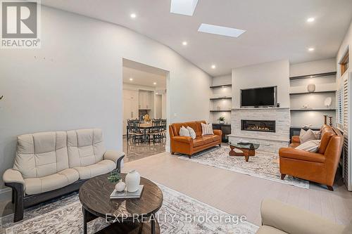 Linear stone framed gas fireplace - 586 Pleasant Park Road, Ottawa, ON - Indoor Photo Showing Living Room With Fireplace