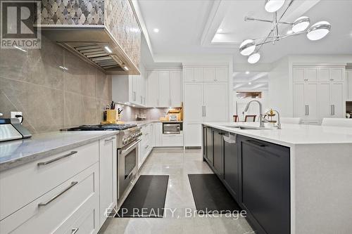 Marble tile floors & backspash, gas stove - 586 Pleasant Park Road, Ottawa, ON - Indoor Photo Showing Kitchen With Upgraded Kitchen