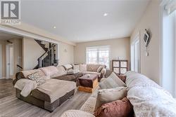 Living room featuring light hardwood / wood-style flooring - 