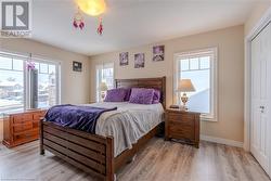 Bedroom with a closet and light hardwood / wood-style floors - 