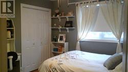 2nd bedroom upstairs with walk-in closet. - 
