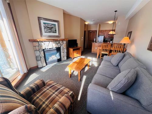 203-2090 Summit Drive, Panorama, BC - Indoor Photo Showing Living Room With Fireplace
