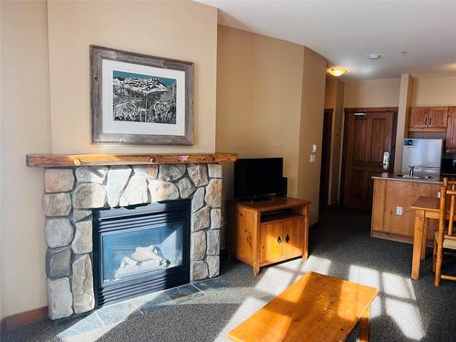 203-2090 Summit Drive, Panorama, BC - Indoor Photo Showing Living Room With Fireplace