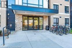 Doorway to property featuring brick siding - 