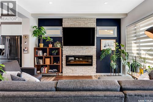 309 Secord Way, Saskatoon, SK - Indoor Photo Showing Living Room With Fireplace