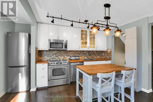 Kitchen with stainless steel appliances - 222 Huntridge, Ottawa, ON - Indoor