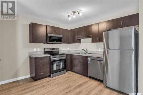 87 5642 Gordon Road, Regina, SK - Indoor Photo Showing Kitchen With Double Sink