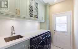 Main Floor Laundry Room with W/O to Backyard - 