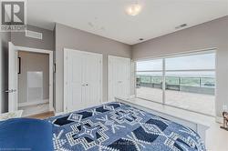 Bedroom featuring visible vents, baseboards, and two closets - 