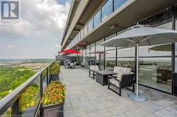 View of patio / terrace with area for grilling and a balcony - 