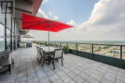 View of patio / terrace featuring outdoor dining space and a city view - 