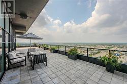 View of patio / terrace with a balcony and an outdoor hangout area - 