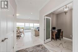 Home office featuring a chandelier, recessed lighting, baseboards, marble finish floor, and ornamental molding - 