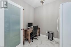 Office space featuring marble finish floor and baseboards - 