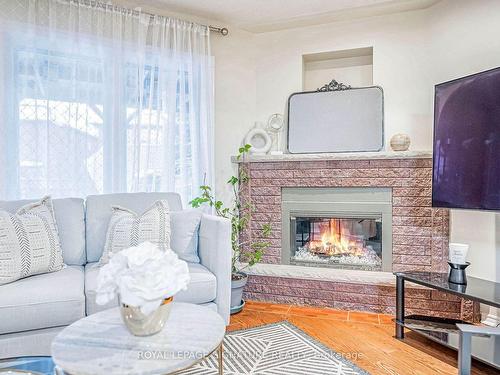 554 Galaxy Crt, Mississauga, ON - Indoor Photo Showing Living Room With Fireplace