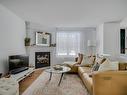Living room - 31 Ch. Bélisle, Morin-Heights, QC  - Indoor Photo Showing Living Room With Fireplace 