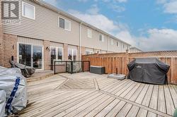 Wooden deck with grilling area and fence - 