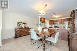 Dining space with light tile patterned floors and baseboards - 