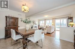 Dining area featuring beam ceiling, visible vents, baseboards, and light tile patterned floors - 