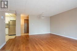 Unfurnished room featuring light wood-style flooring and baseboards - 