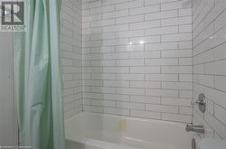 Full bath featuring shower / bath combination with curtain - 