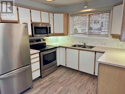 Bright kitchen with under-cabinet lighting. - 