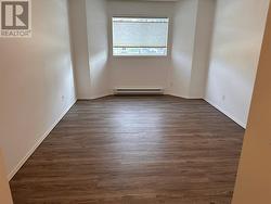 Fresh flooring (luxury vinyl plank) in 15 foot long Master Bedroom. - 