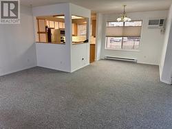 Living room looking back to kitchen. - 