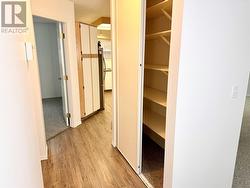 Hall closet and entrance to kitchen and second bedroom. - 