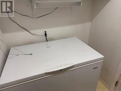 Deep freeze in laundry room. - 