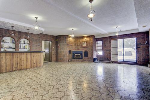 Family room - 12040 Rue Jasmin, Montréal (Ahuntsic-Cartierville), QC - Indoor With Fireplace