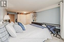 Bedroom featuring carpet floors and a textured ceiling - 