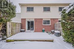 View of snow covered rear of property - 