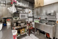 Kitchen featuring white microwave and tasteful backsplash - 